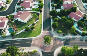 aerial view of neighborhood with white houses with red roofs