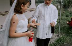 Wedding ceremony at trailer park with soda bottles