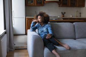 Woman pondering while looking out the window