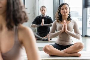 People meditating on yoga mats