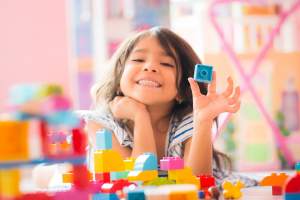 Little girl playing with blocks