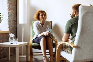 Man talking to female therapist