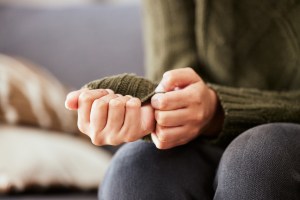 Close up of woman's hands, anxiously wringing her hands